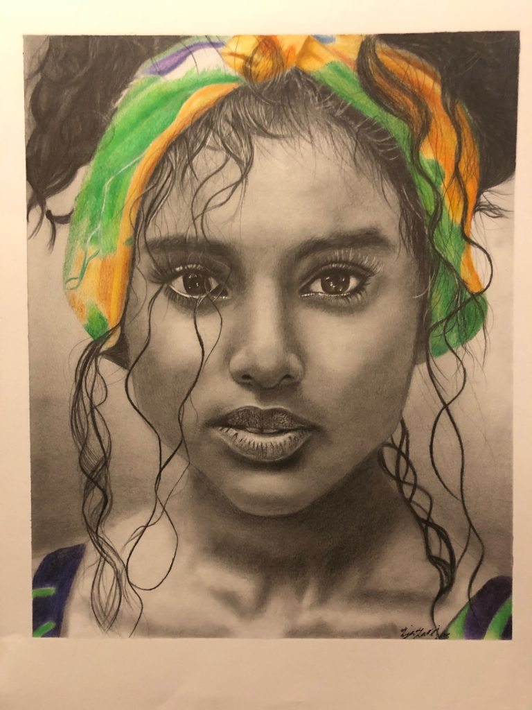 Pencil drawing of a woman's face in black and white, wearing a colourful green and yellow headband.