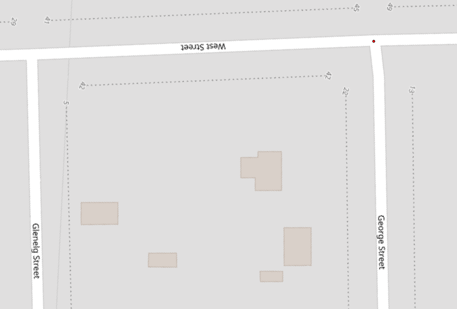 Figure 3.22. In the Georeferencer window a red dot marks the control point where the red plus sign used to be located on the OpenStreetMaps map.
