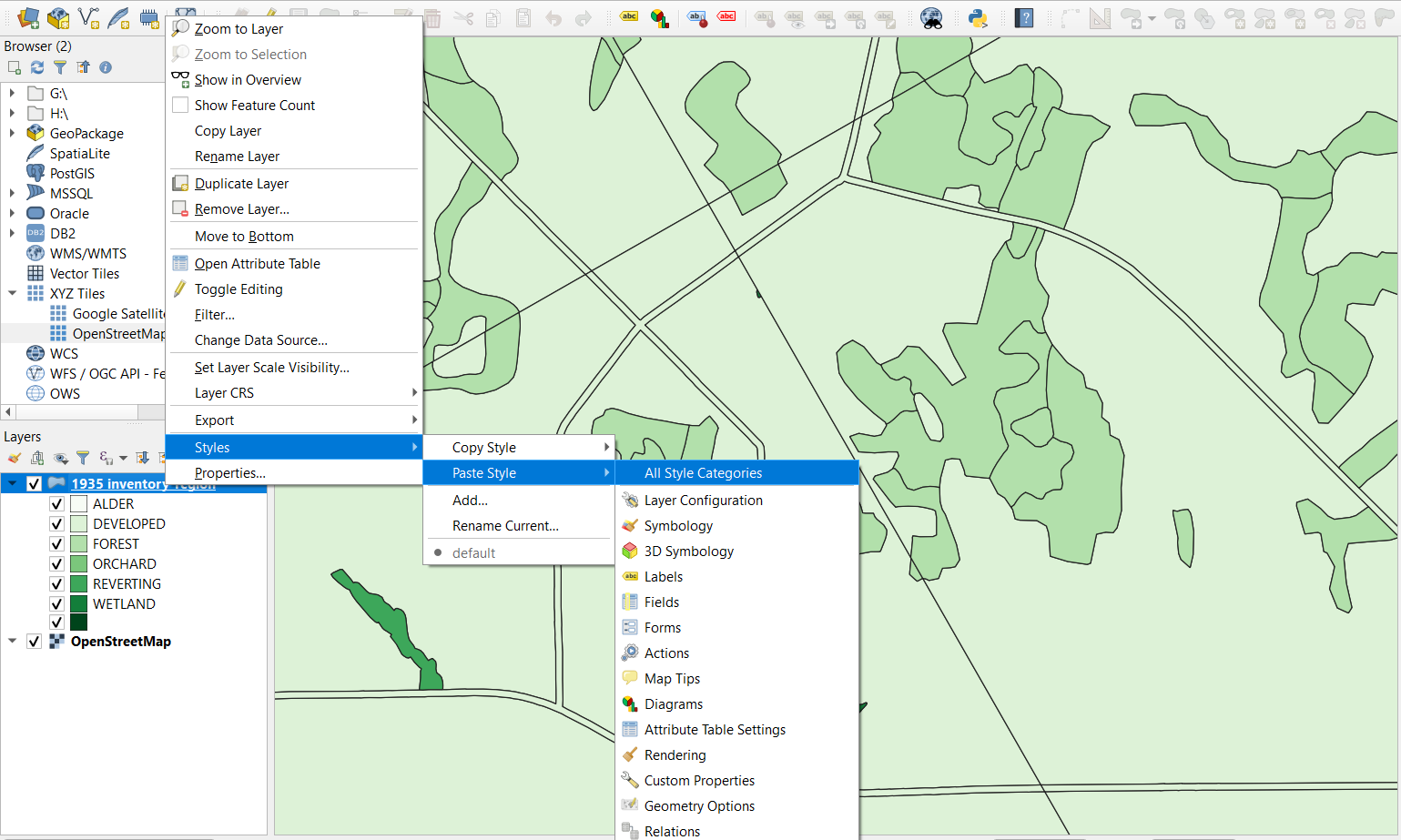 Figure 2.111. This image shows the QGIS window with the 1935 inventory layer selected, with a pop-up where the second last option (Styles) is highlighted. From this first pop-up stems a second pop-up where the second option (Paste Style) is highlighted. The final pop-up that stems from the second has the first option (All Style Categories) selected.