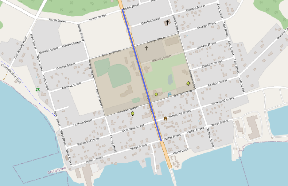 Figure 4.38. The blue box on the perimeter of Kent Square is now shaded in and fit to the OpenStreetMap image of Kent Square with the blue line down Kent St. visible going through the Square.