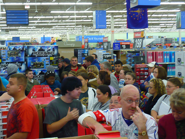 A picture of the chaos of Walmart on Black Friday. Customers everywhere in disordered lines, waiting to check out
